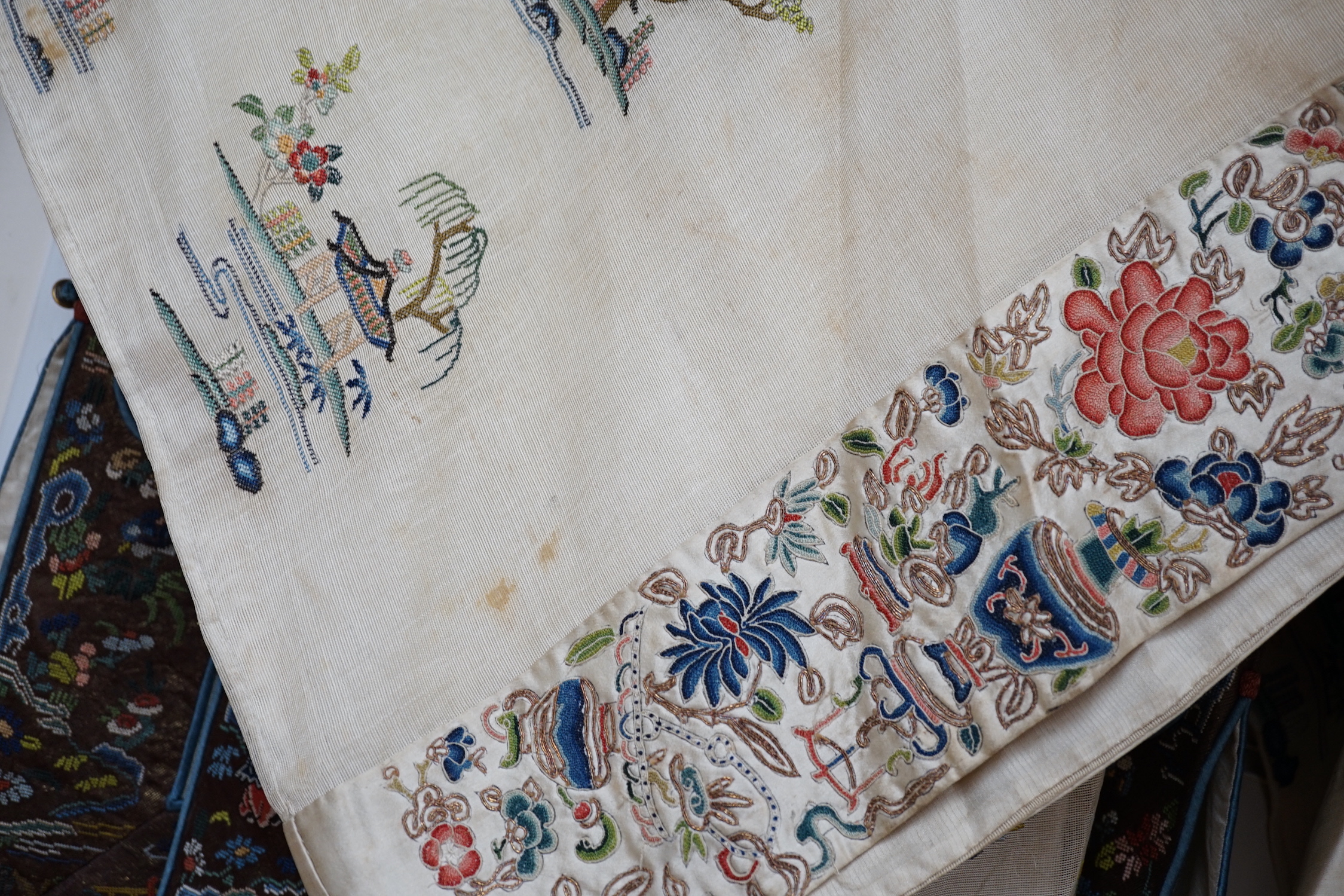 A late 19th/early 20th century Chinese gauze summer robe embroidered with flowers, figures and pagodas, 85cm high